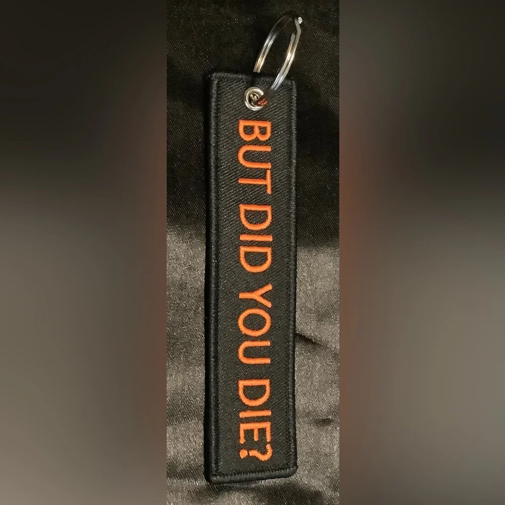 Black Keychain with Orange Text